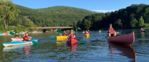 a group of people kayaking on a river