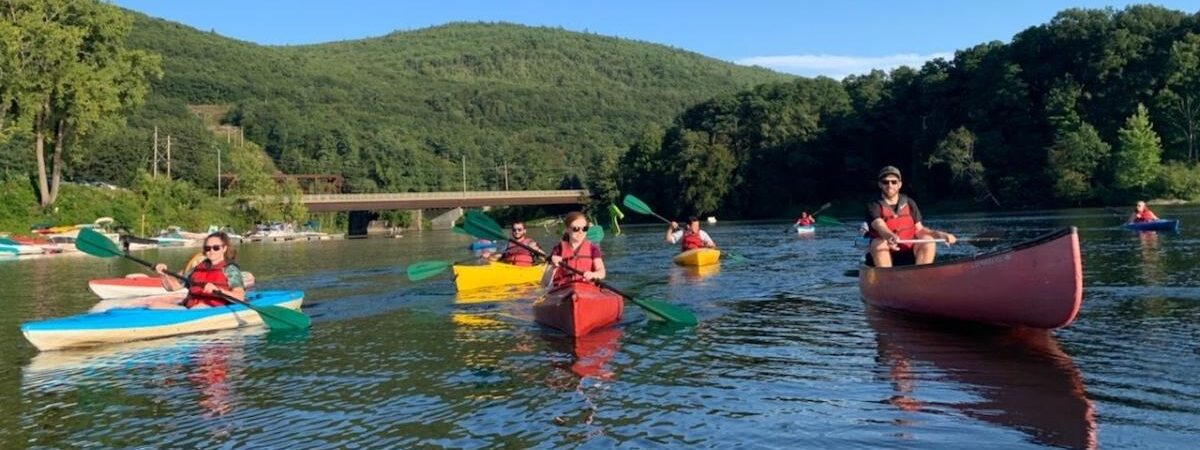 a group of people kayaking on a river